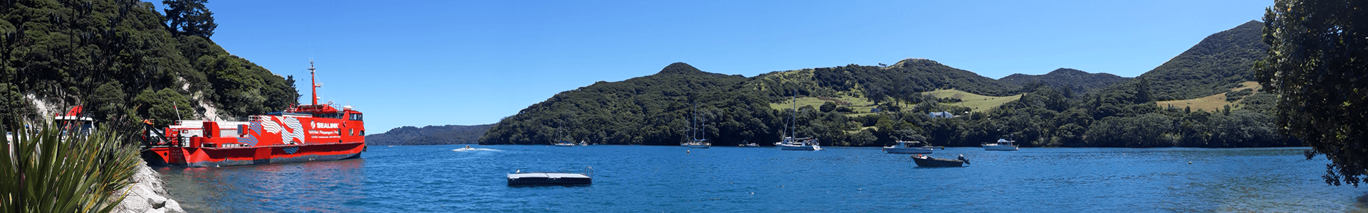 Port Fitzroy wharf on Great Barrier Island panorama