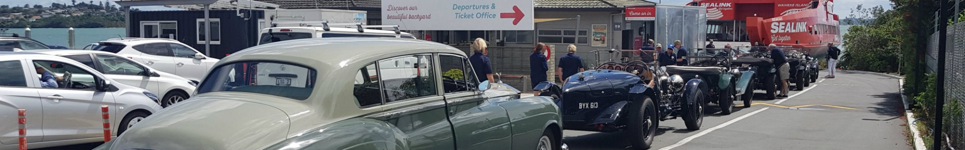 Vintage cars ready to board at Half Moon Bay ferry terminal