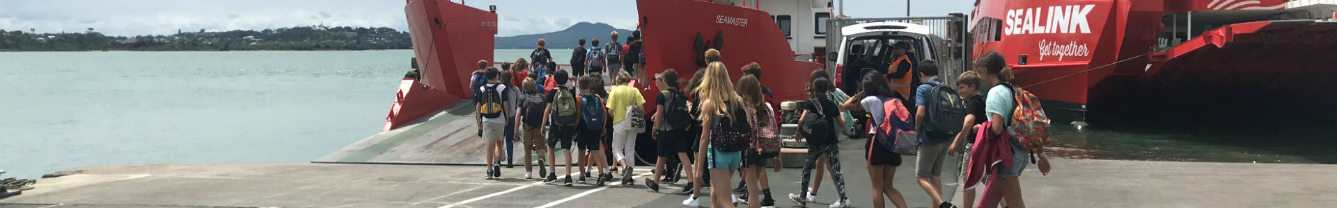 School group walking onto the Seamaster SeaLink ferry