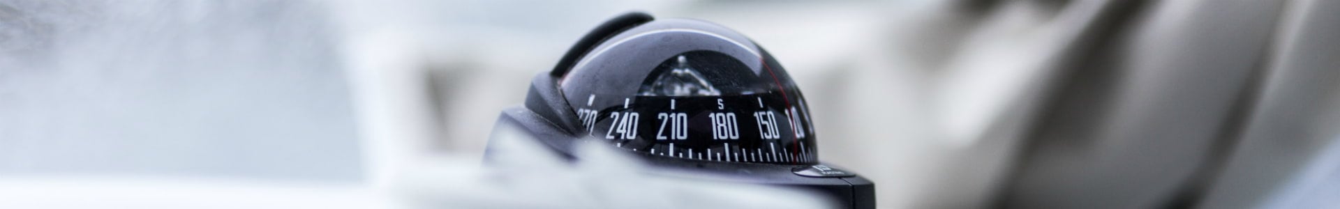 Image of a compass in a wheelhouse