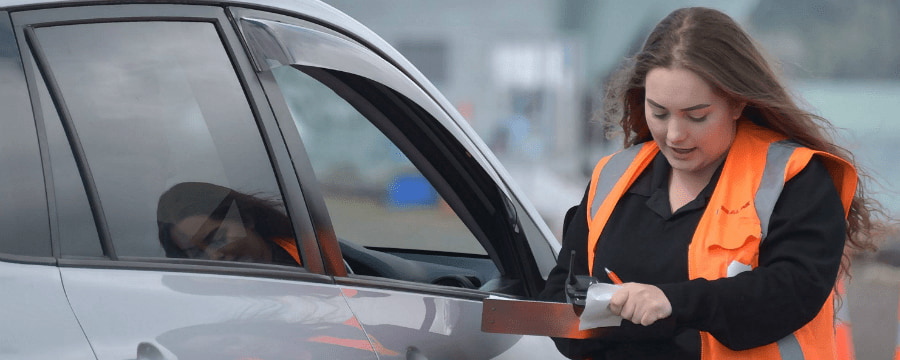 SeaLink employee checking in a customer