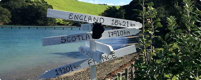 Sign showing distances to other countries from Rakino